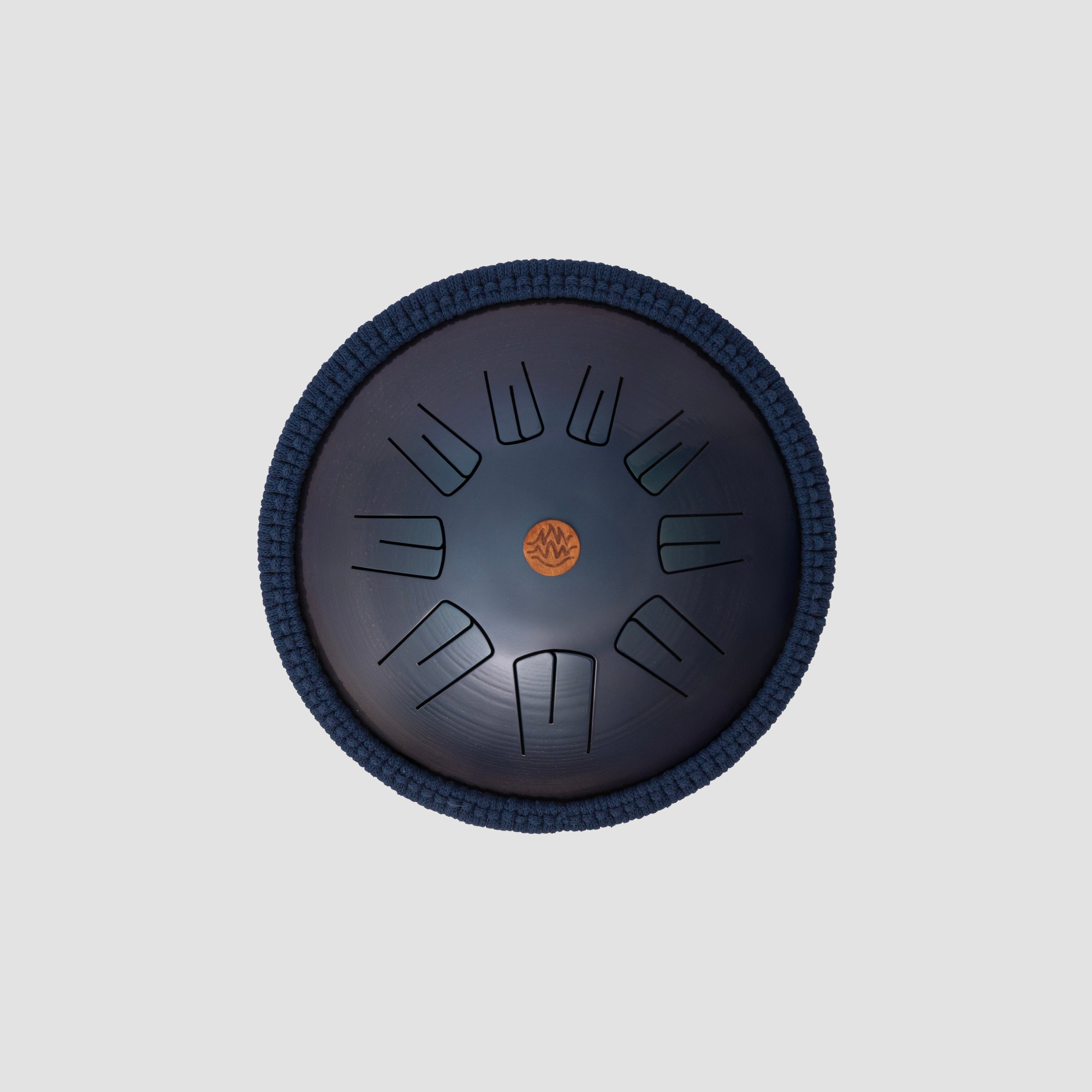 Blue ocean color steel tongue drum at light gray background