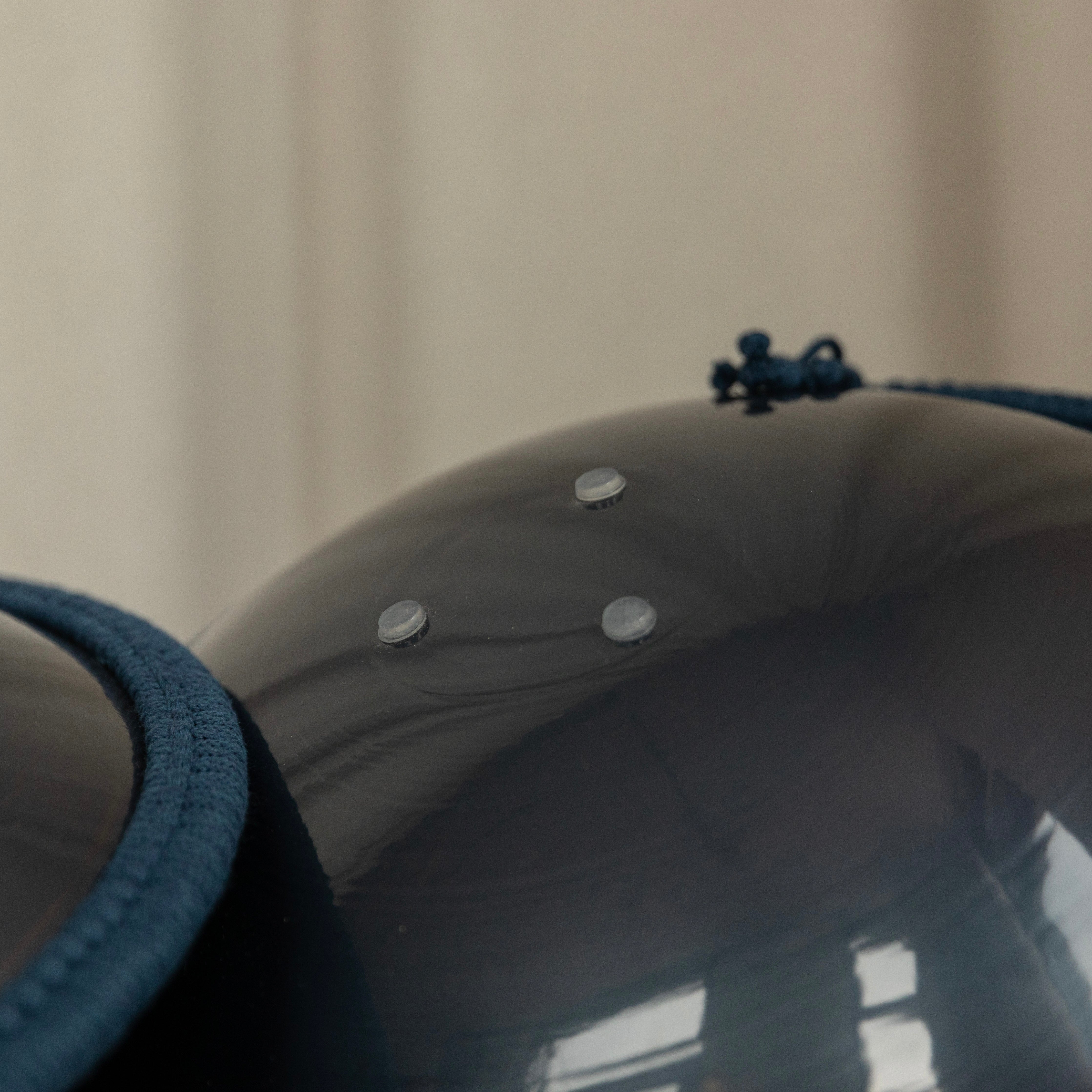 Close up view on a three silicone feet of tongue drum Burning27