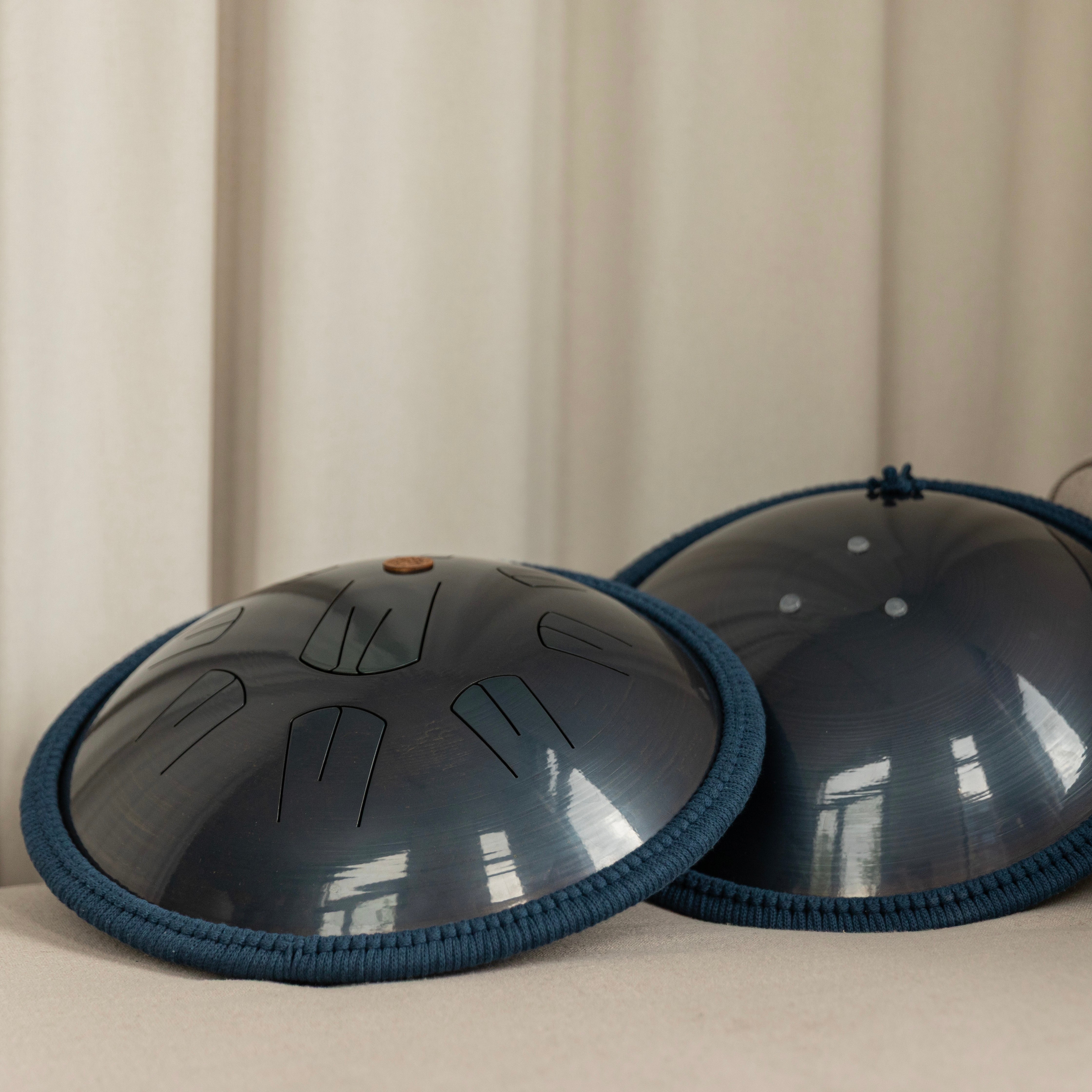 Top and back side views of Ember model drum