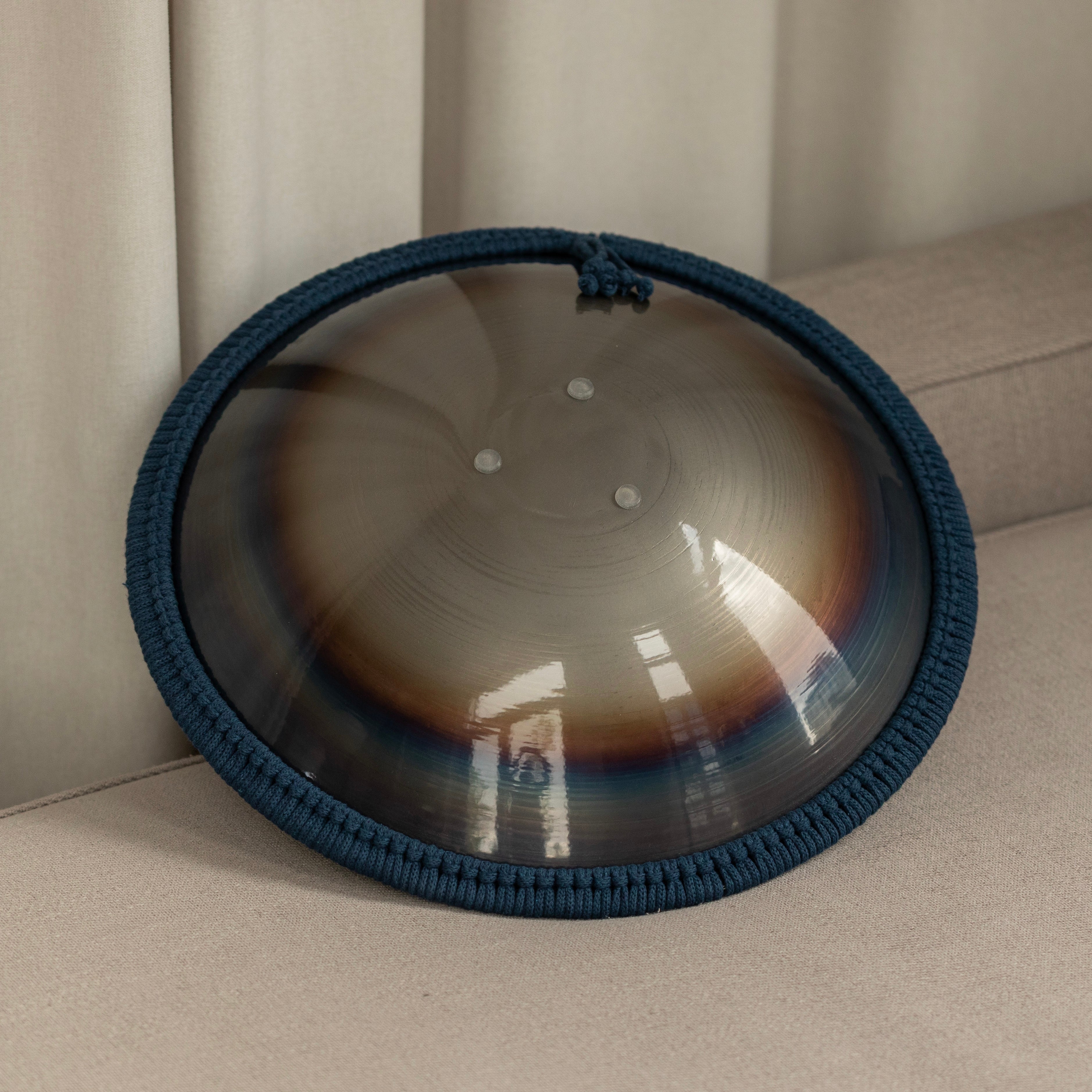 Back view of tongue drum in rainbow multicolor design by Burning27