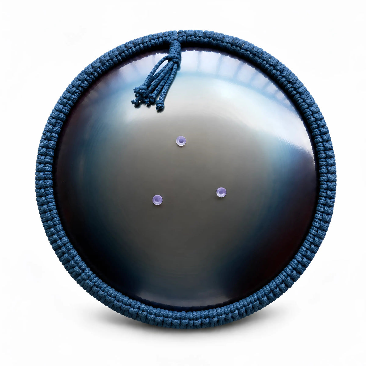 Back-side view for a bottom of steel tongue drum, dark blue surface color and three protective feet, the rim covered with blue woven macrame rope, located on a white background.