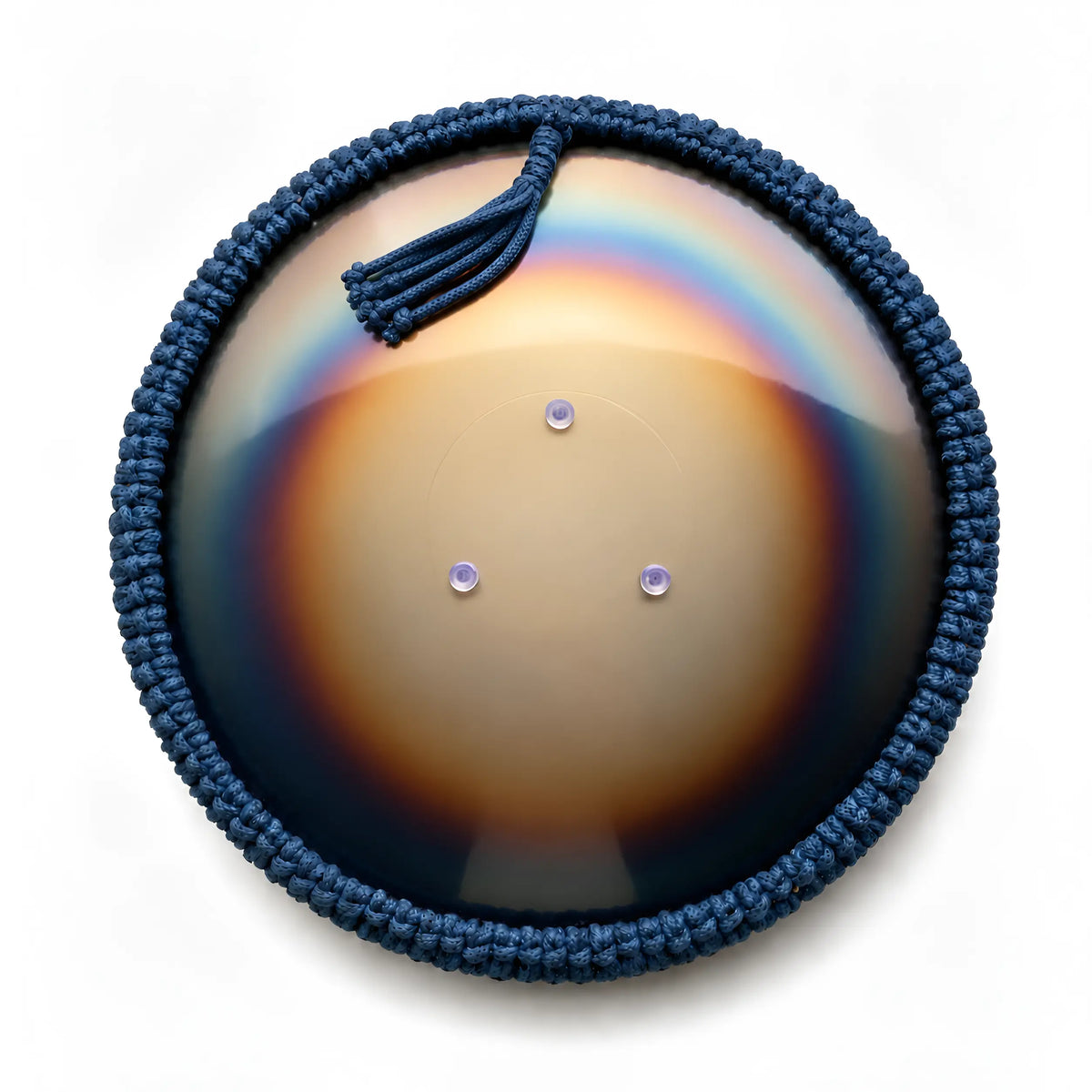 Rear view for bottom side of a small steel tongue drum Spark V2 model handcrafted by Burning27 wokrshop, with a colorful reflective Rainbow Glow surface and blue woven macrame rim, located on a white background.