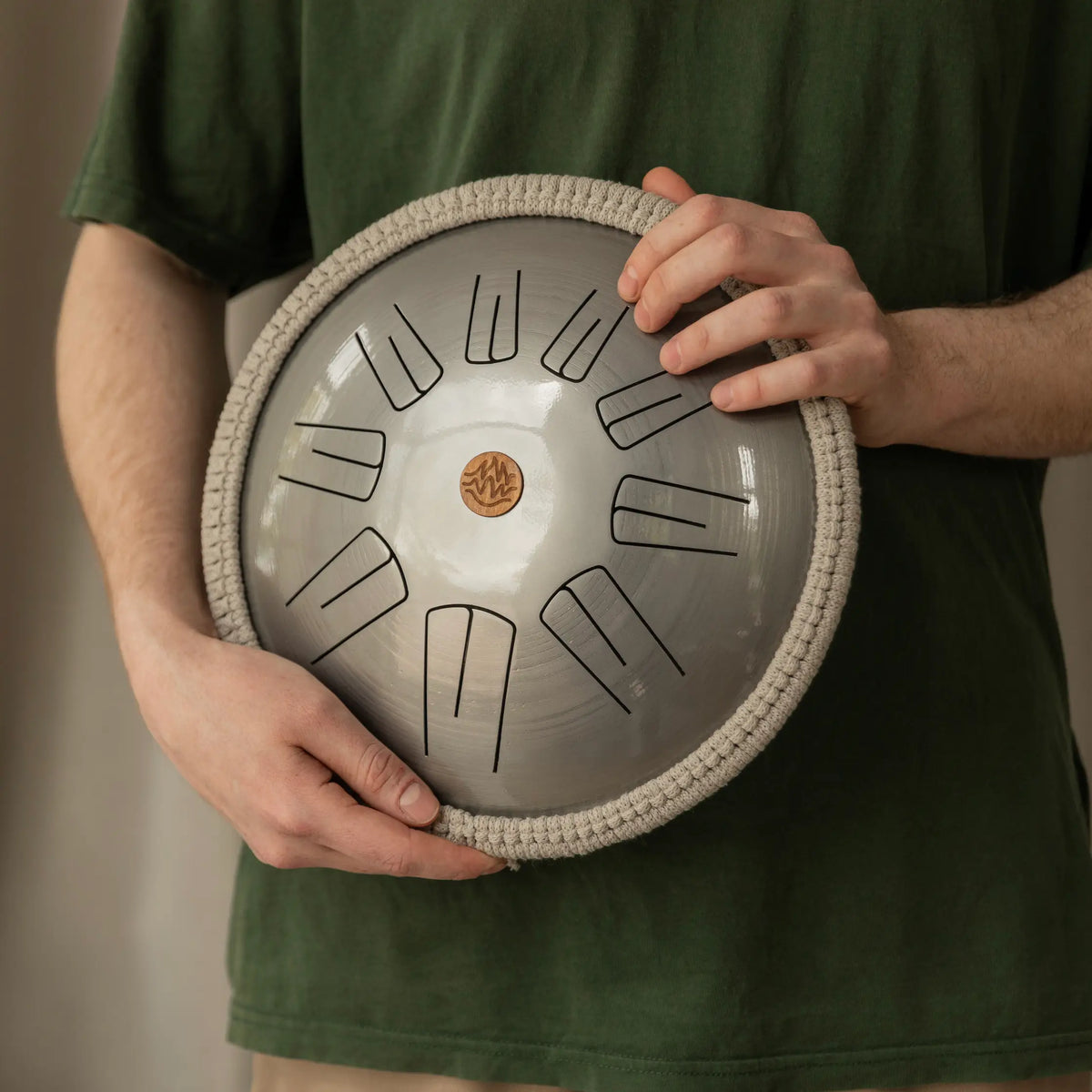 Handmade steel tongue drum for beginners in silver color with 9 notes, made by Burning27 workshop